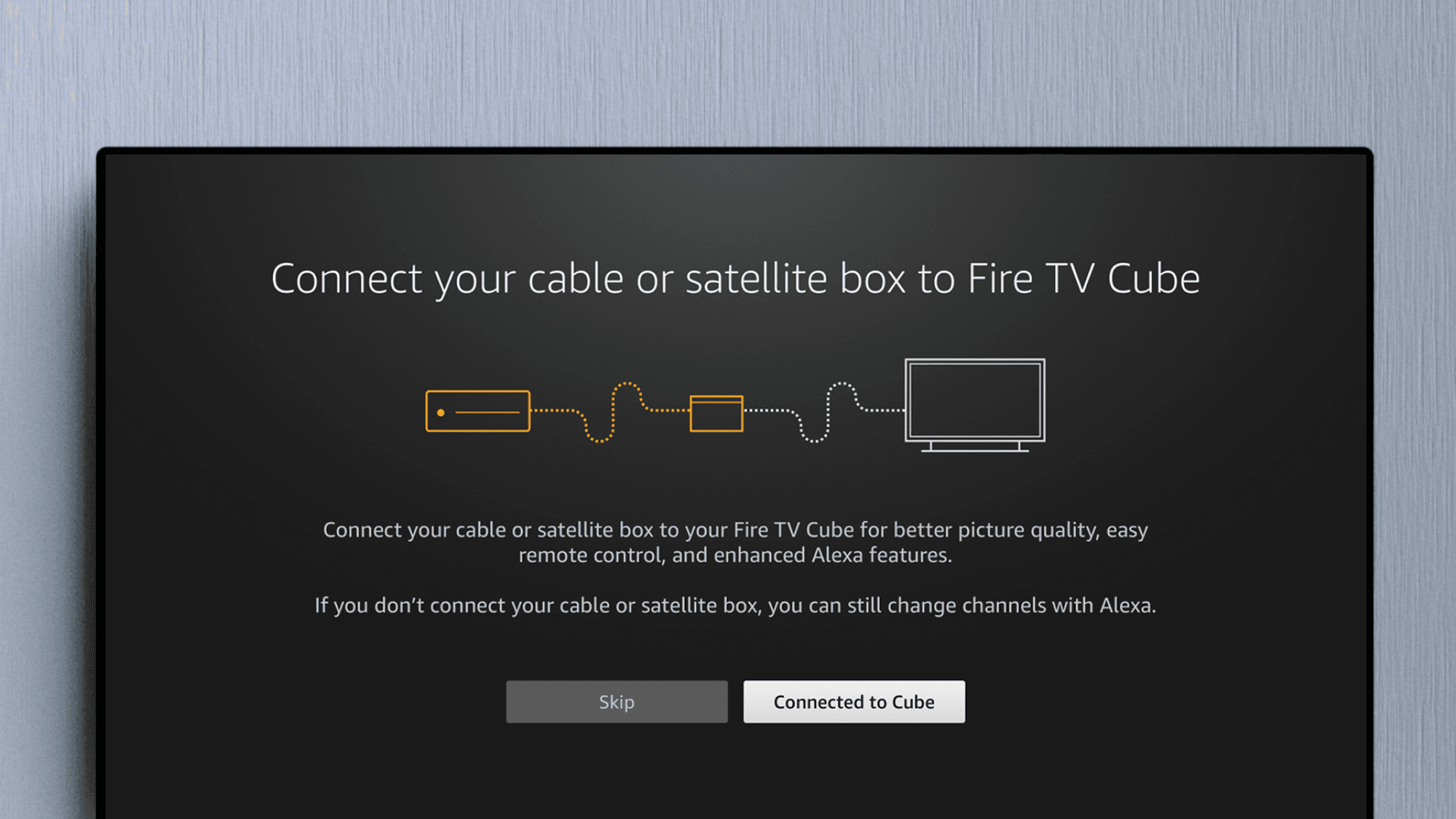 Fire TV Cube setup screen with an illustration of a cable box connecting to Fire TV Cube and a TV